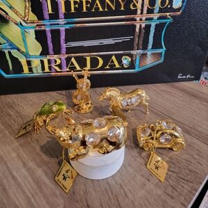Gold crystal animals and car and violin